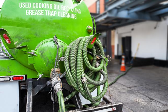 pumping out grease trap at commercial kitchen in Amity